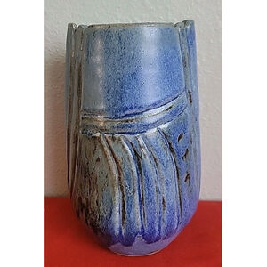 Vintage, artist-signed sandstone vase with a blue glaze and textured.